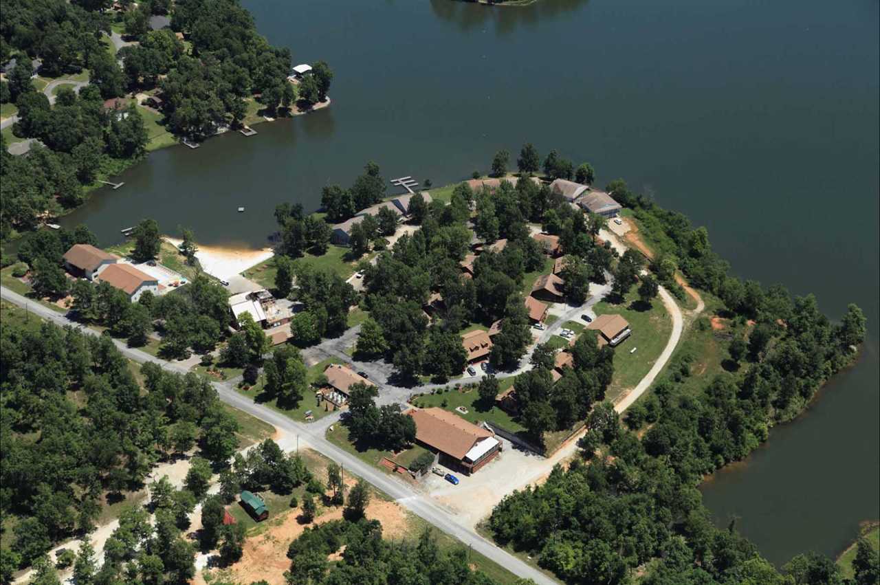 A rustic resort on a peninsula on a lake.