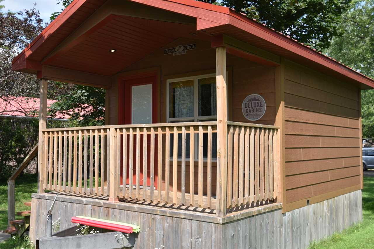 Camping cabin with red roof.