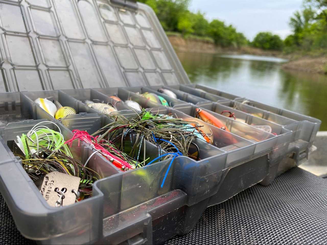 Tacklebox packed with lures and fishing line.