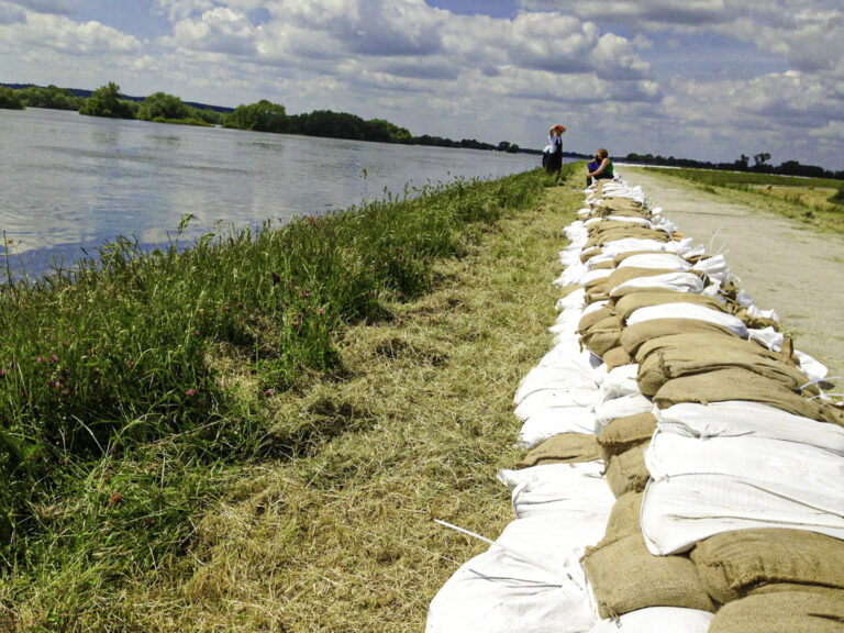 sandbag wall on a river bank
