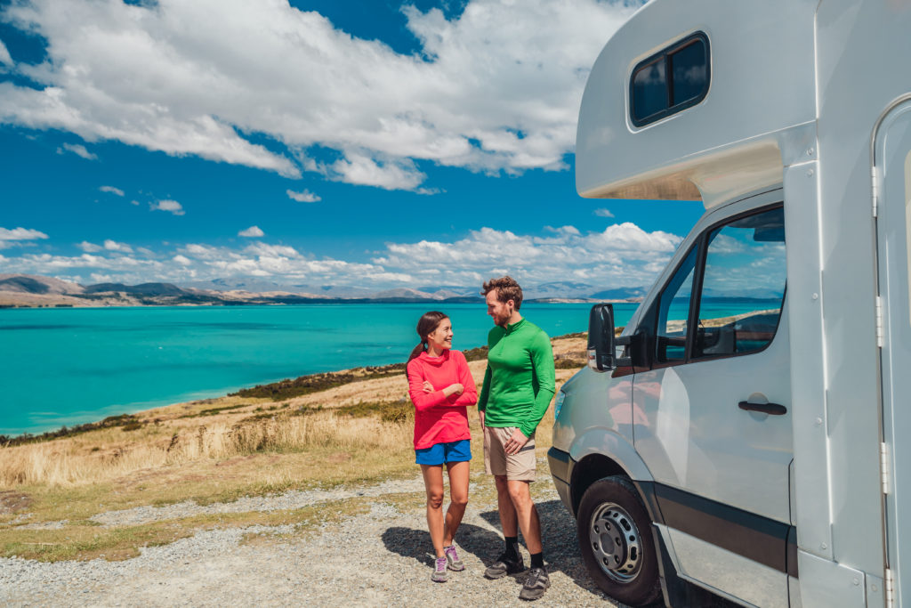 RV Couple by Lake