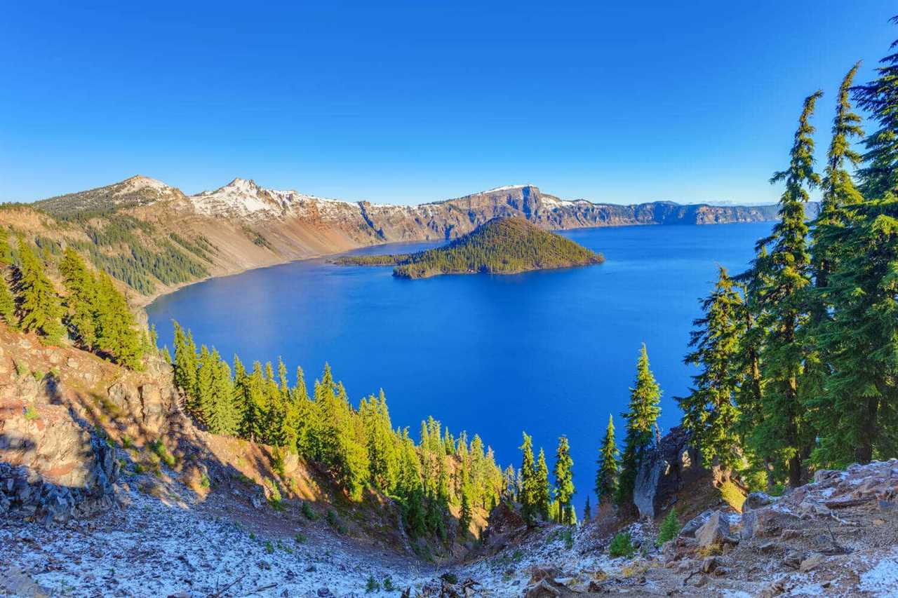 A circular lake with a small island in the middle