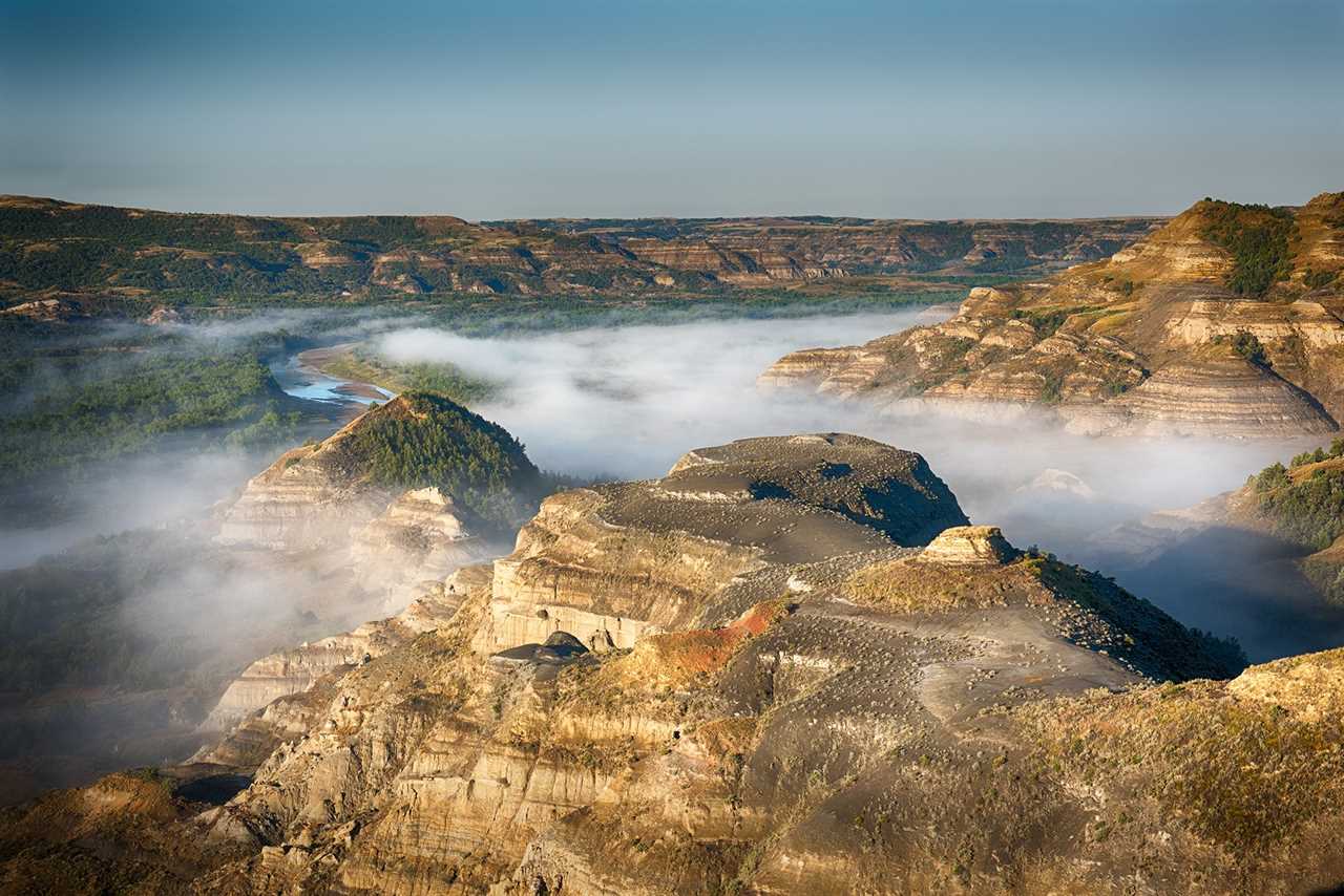 Fog hangs over river valleys.