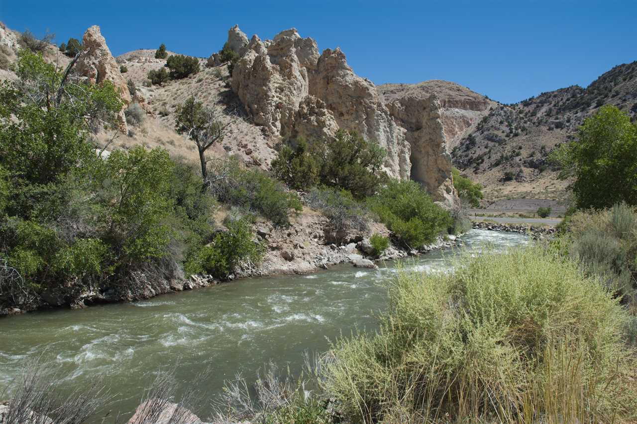 Whitewater churning through arid valley.