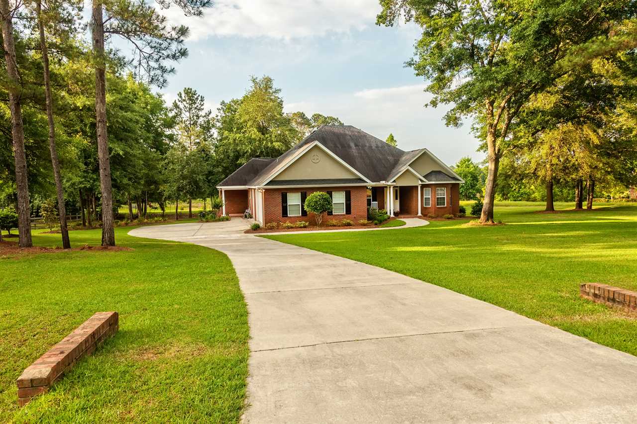 A residential house with a large yard in northern Florida