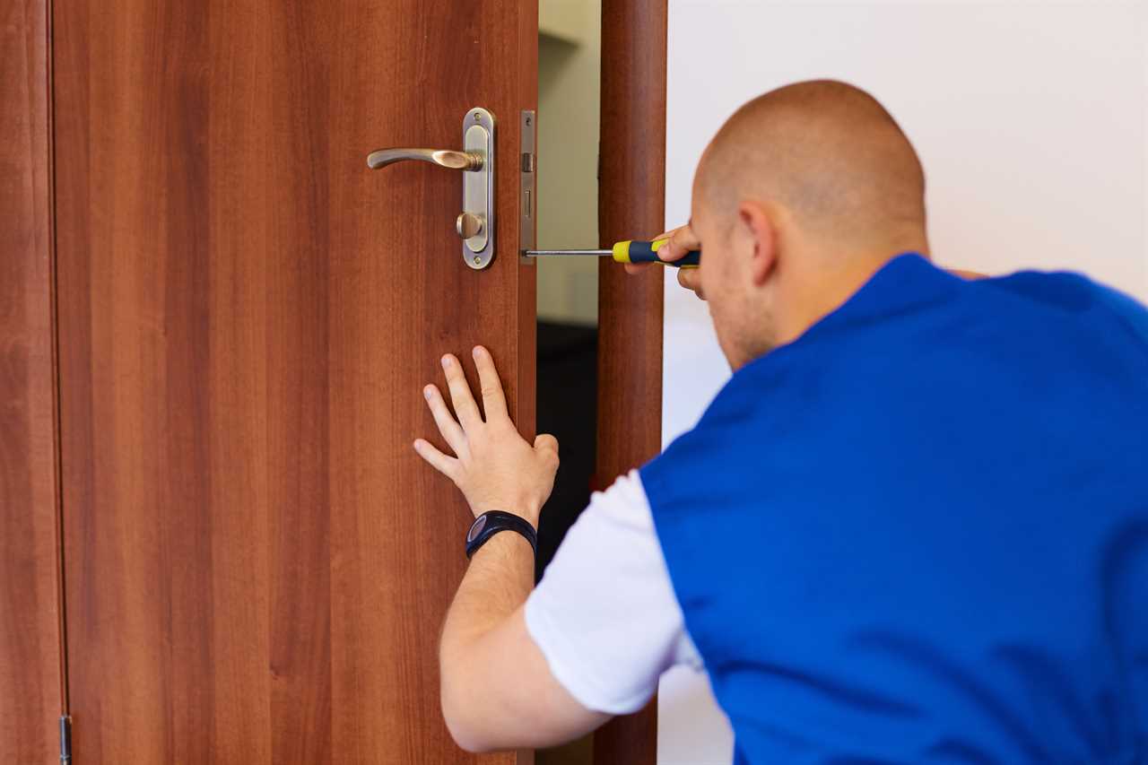 Portrait Young Male Carpenter Repairing Door Lock