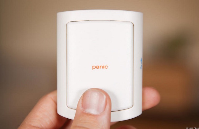 Hand holding a panic button