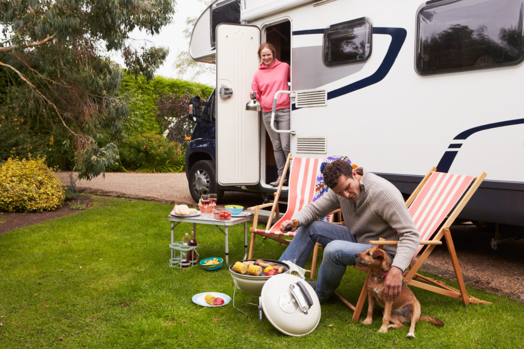 RVing Couple with Dog and Grill