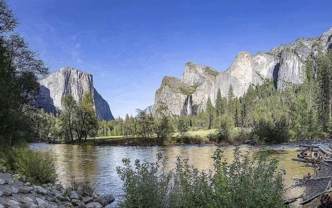 Giant rock faces against a blue sky.