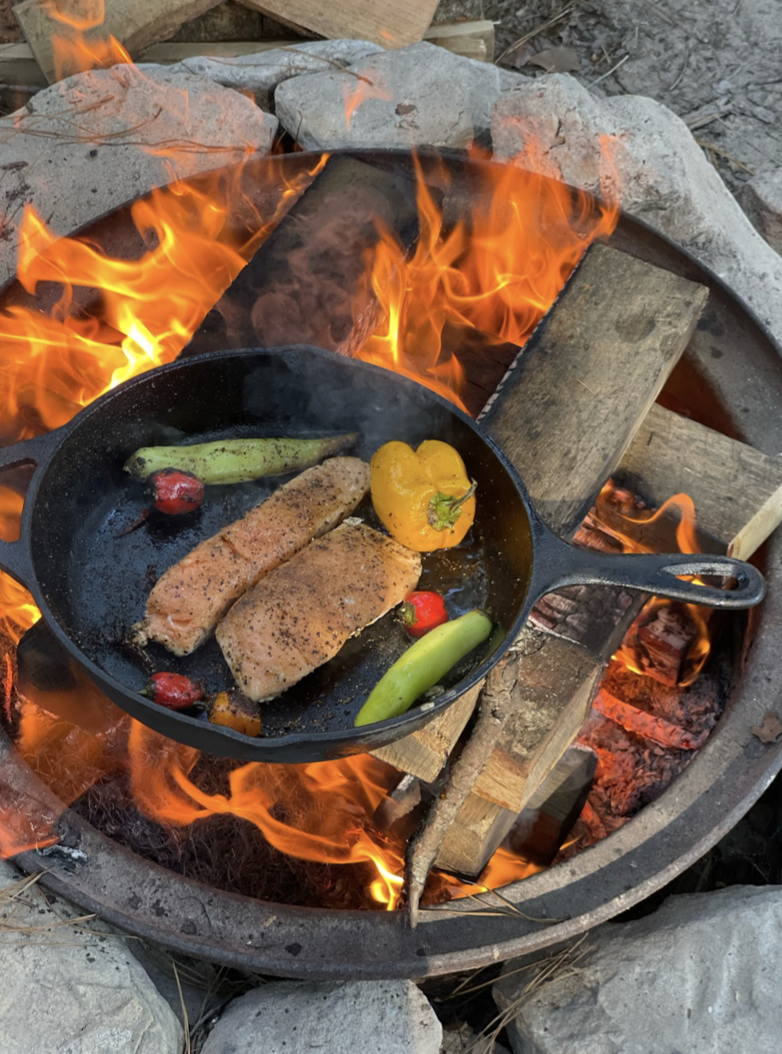 cooking food over campfire