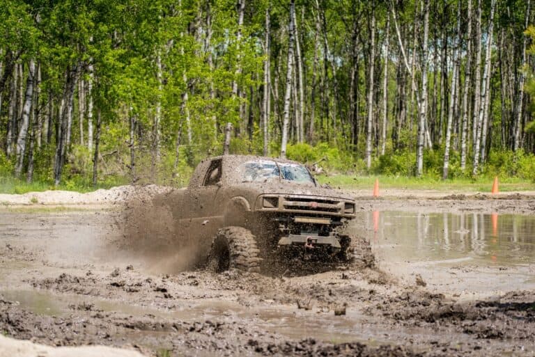 a muddy 4x4 Chevy vehicle