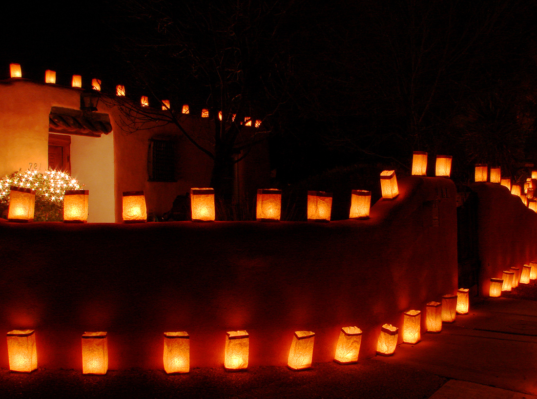 Luminarias perched upon residential walls. 