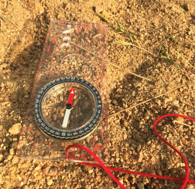 a boxed compass on the ground