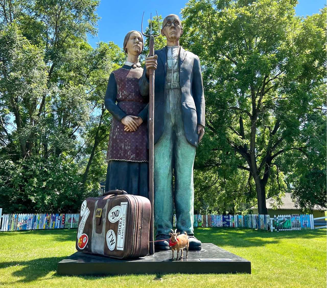 Statue of man with pitchfork and wife.