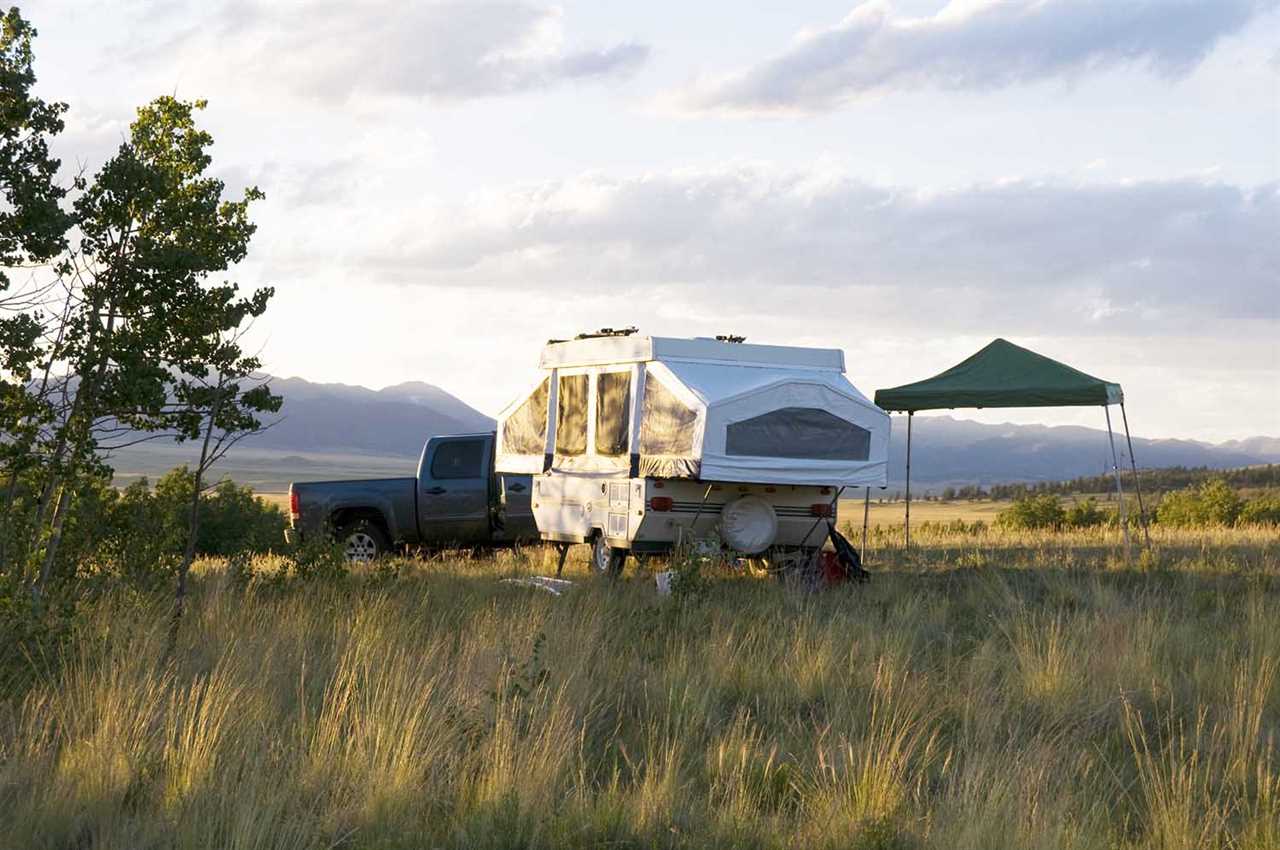 Popup camper in Colorado meadow.
