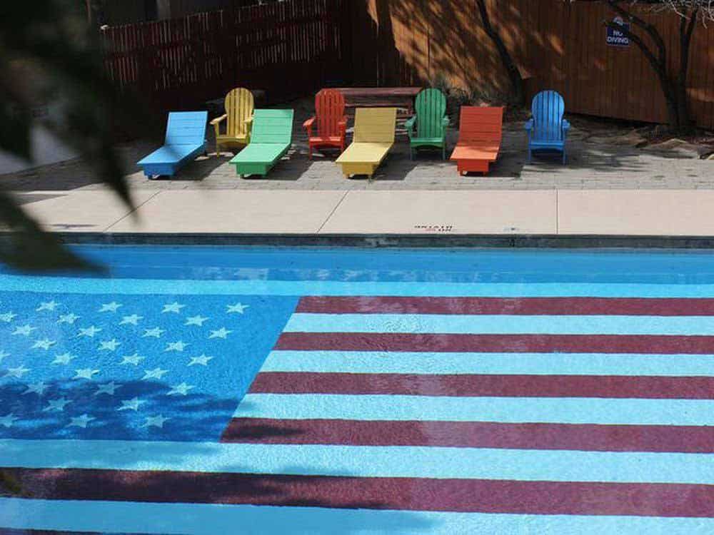 Swimming pool with American flag painted on the bottom.