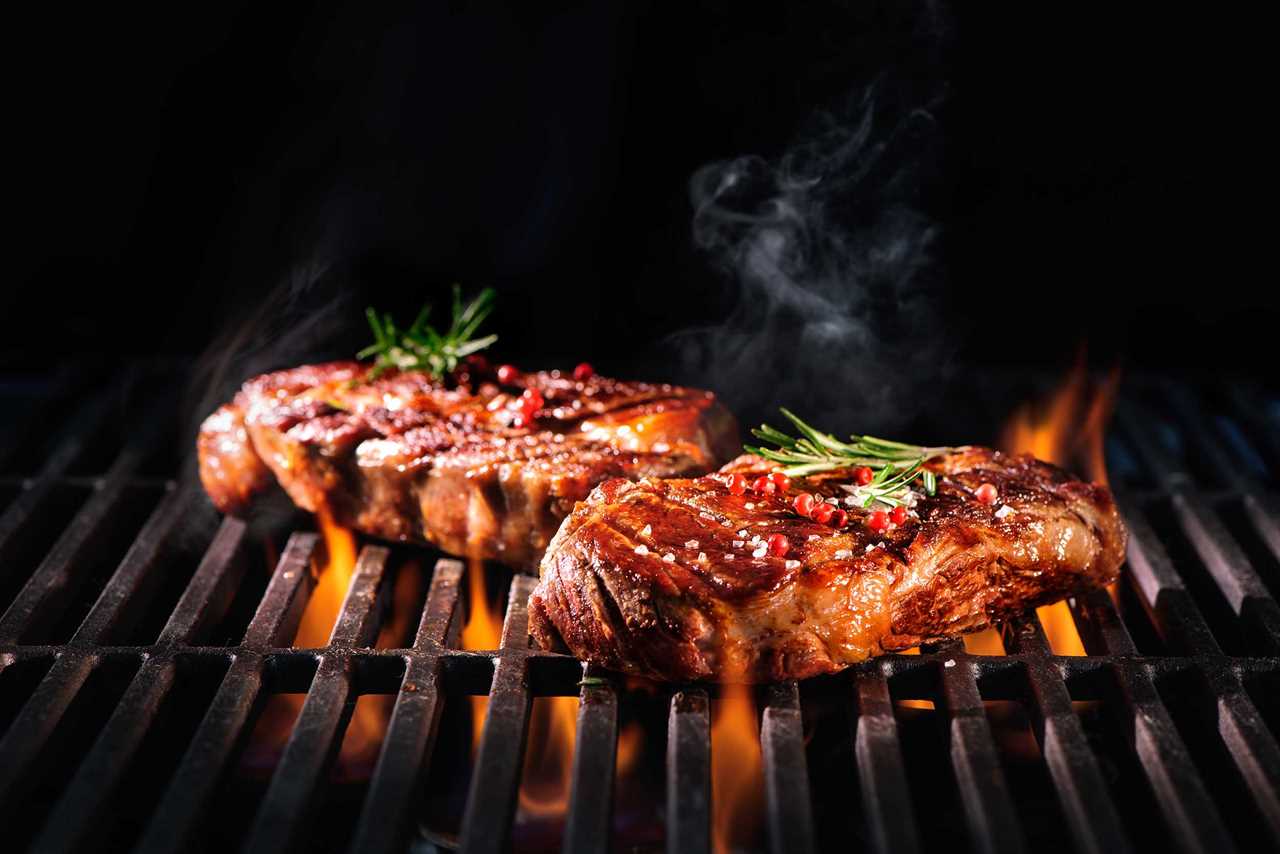 Succulent barbecue steak on grill. 