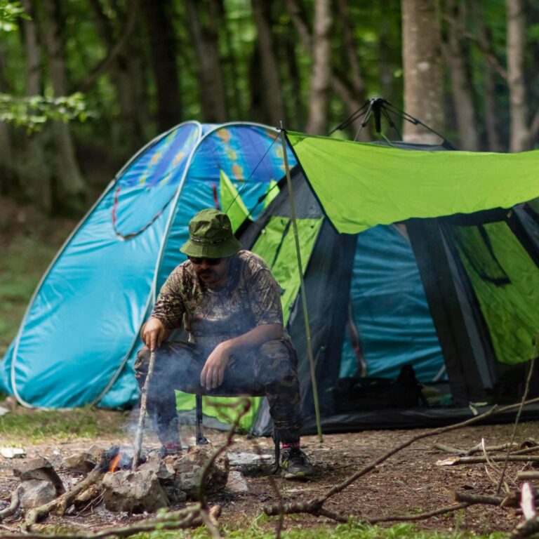 man camping in the woods