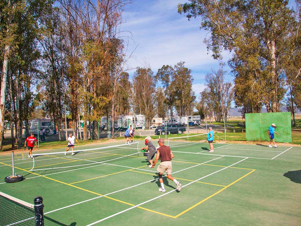 Campers playing at pickleball courts.