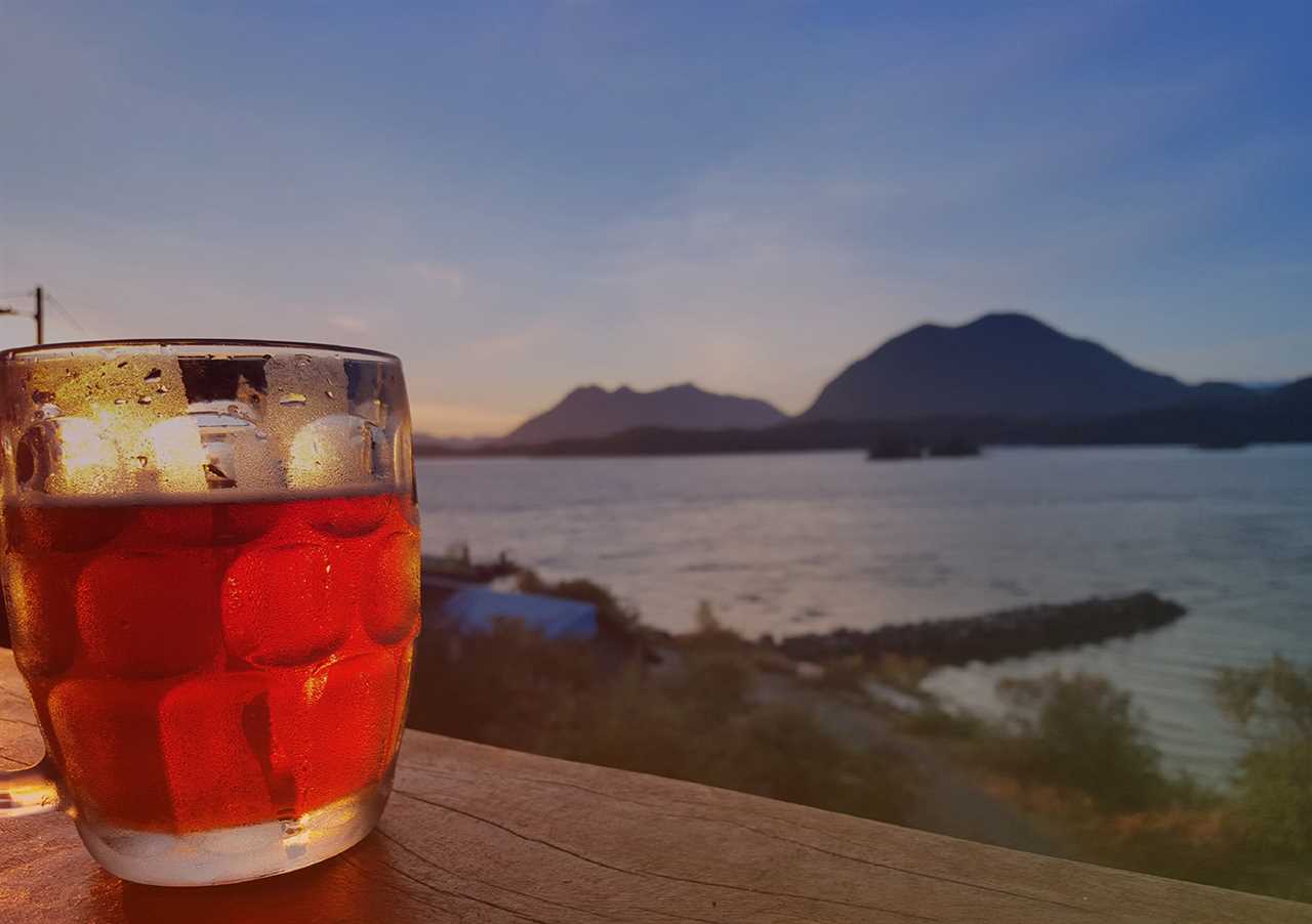 Beer glass with ocean in the background