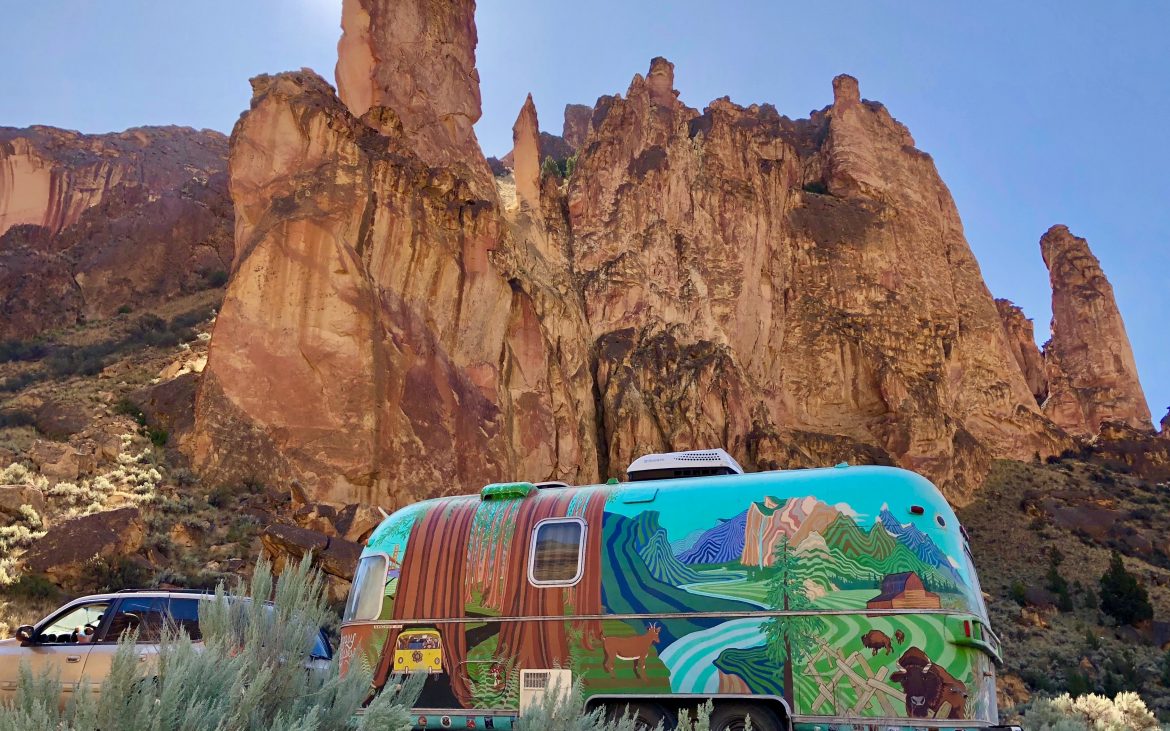 Huge red rock spires tower over the road to Sucor Creek Campground. 