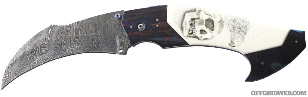 Studio photo of Reese Weiland's Rastor hawkbill blade in the open position.