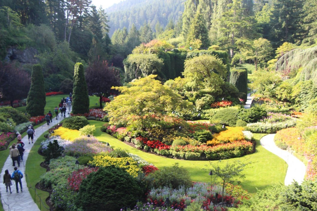 A path winds around lush gardens