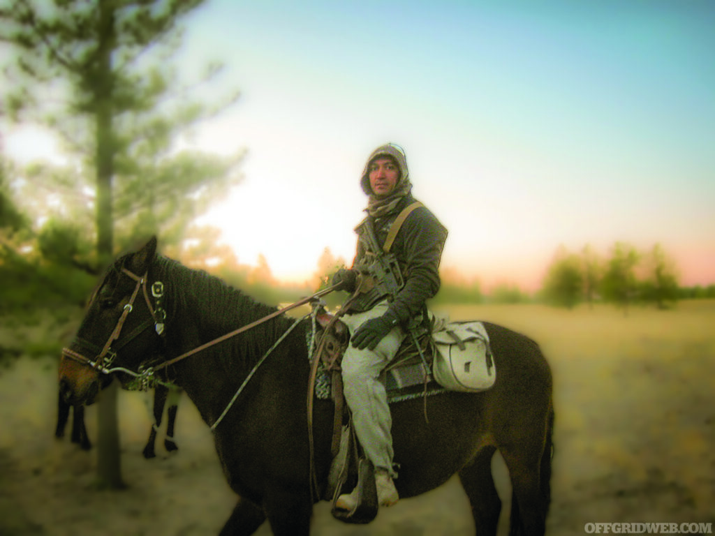 Green Beret Kawa Mawlayee sits atop a mule in Afghanistan.