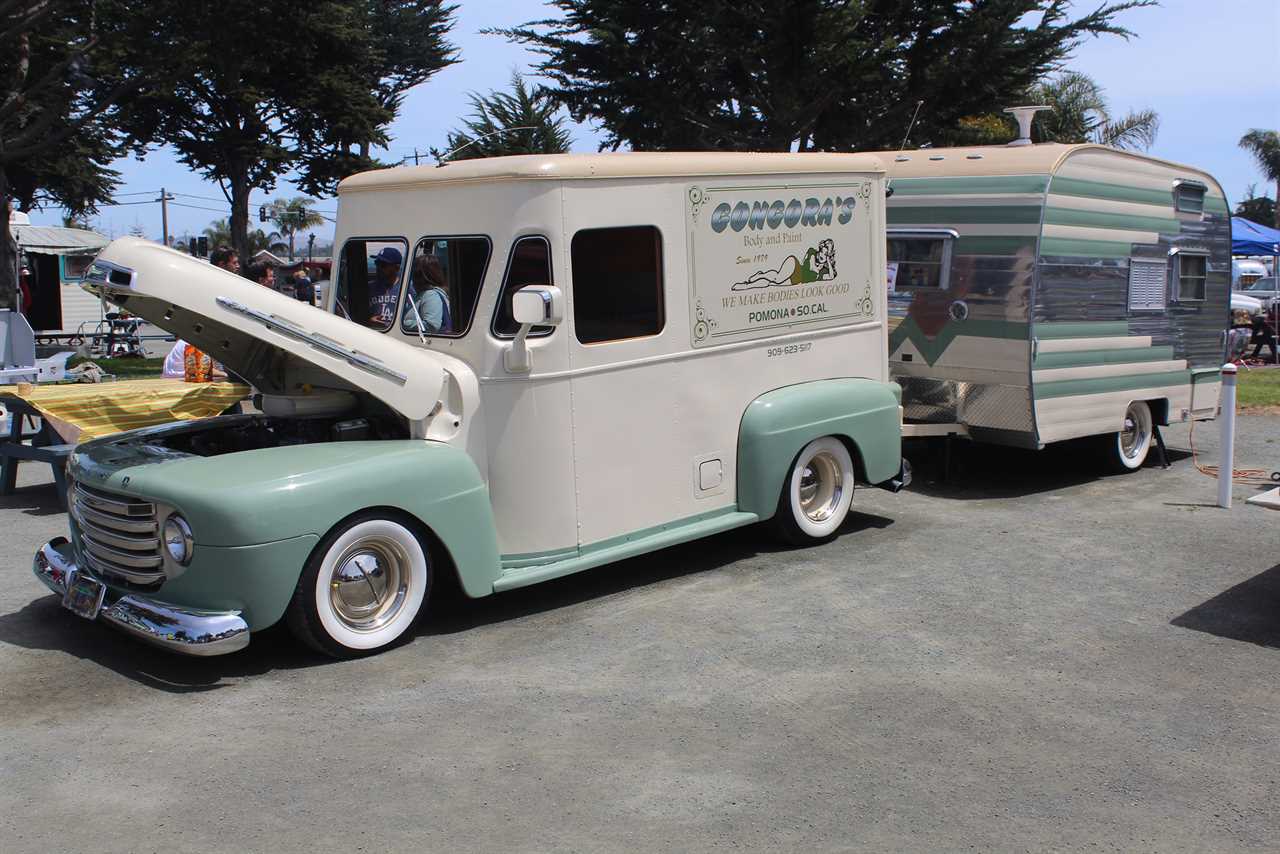 Iconic tow vehicle with a trailer, beige and olive green color scheme.