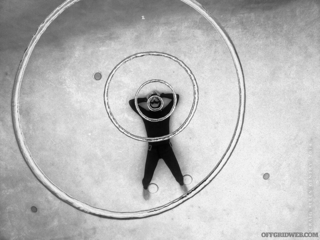Black and white photo of Kirk Krack blowing rings underwater.