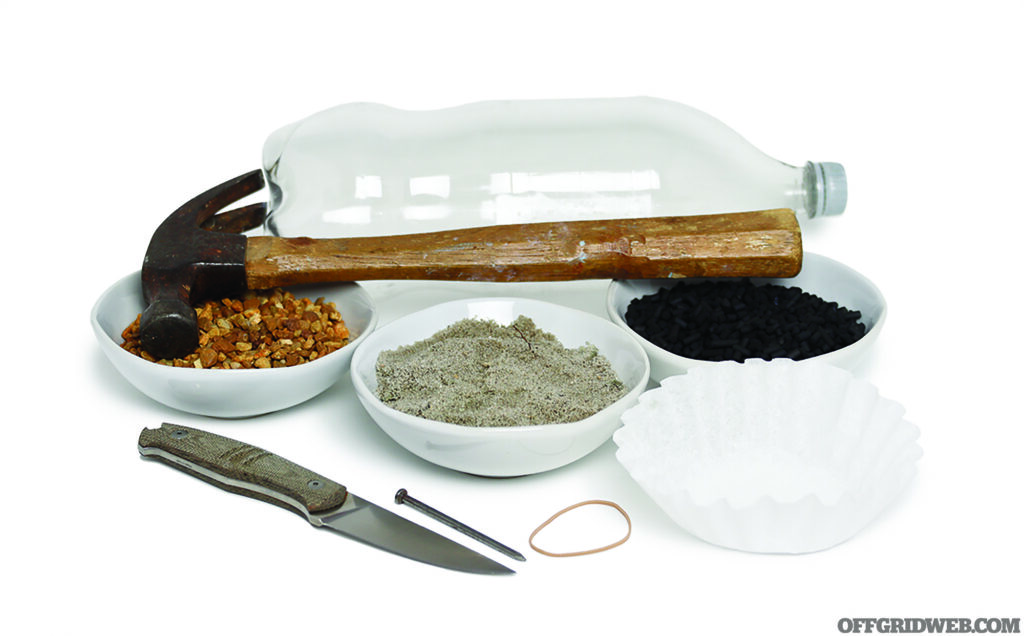 Studio photo of a plastic bottle with a cap, a knife, hammer and nail, a coffee filter, activated charcoal, sand and gravel.