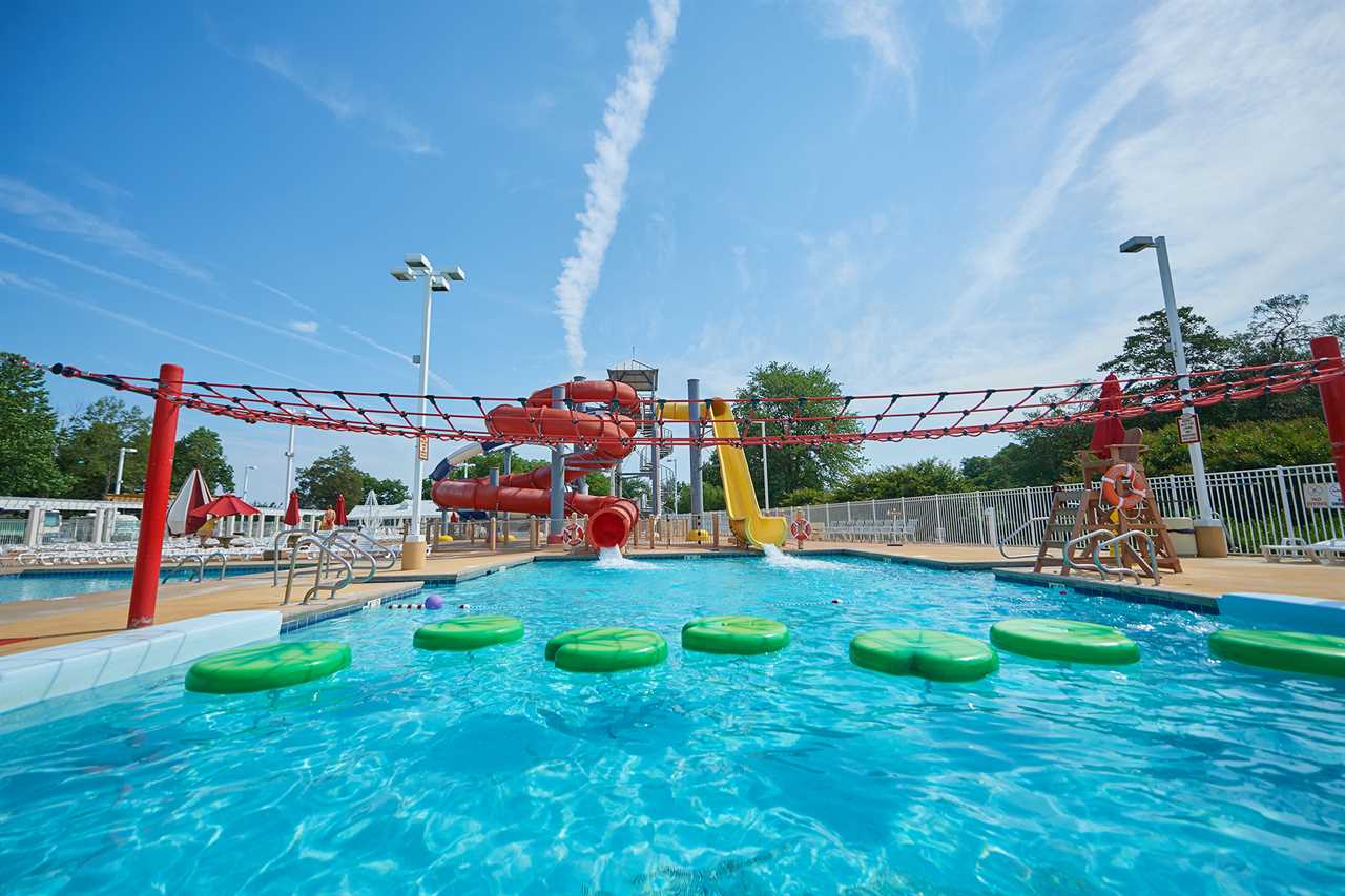 A big waterslide emptying into a pool. 