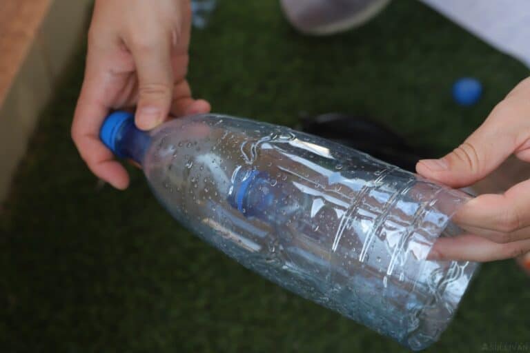 two nested plastic bottle funnels