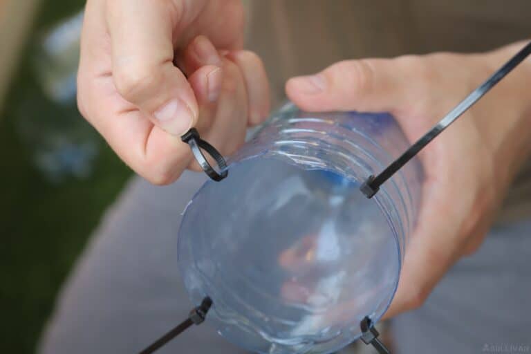 fixing the bottles with four zip-ties