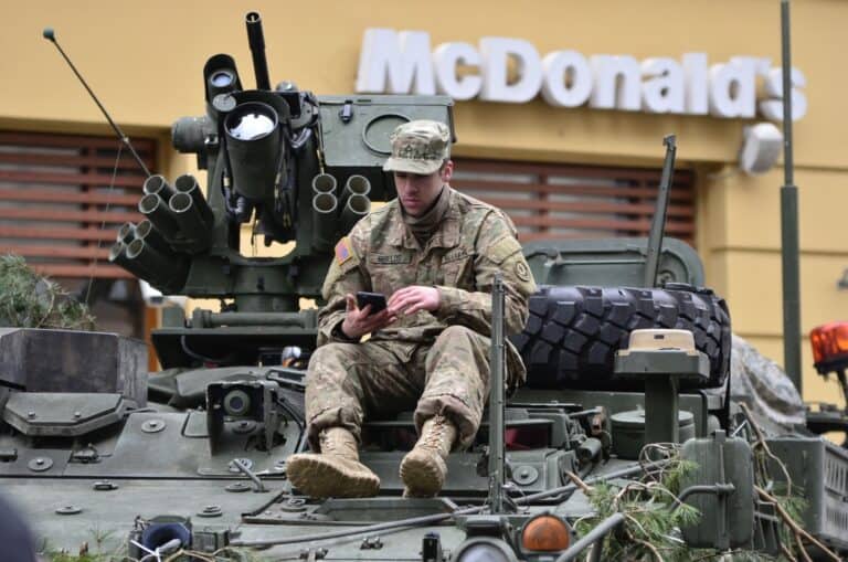 man on top of tank