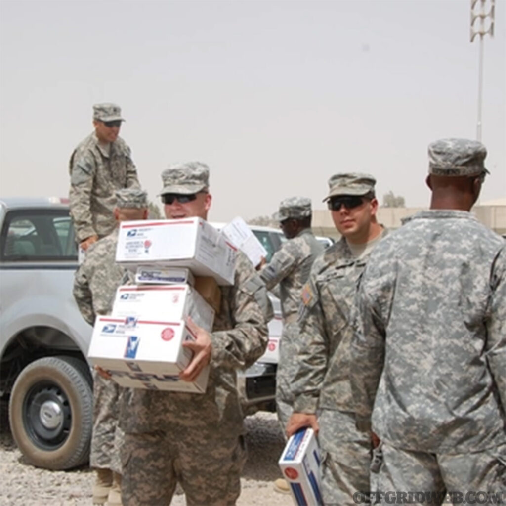 Photo of a group of military personnel happy to be receiving mail.