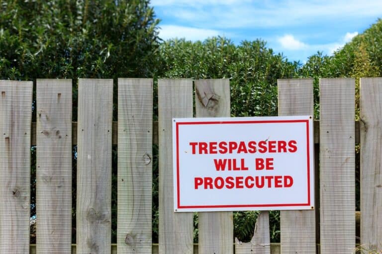 trespassing sing on fence