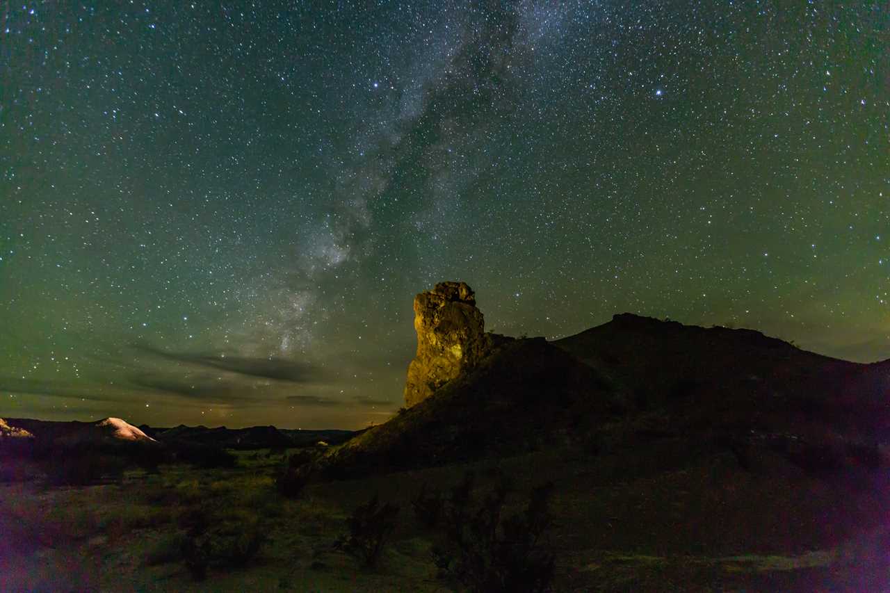 Milky Way rises over a rugged rock formation