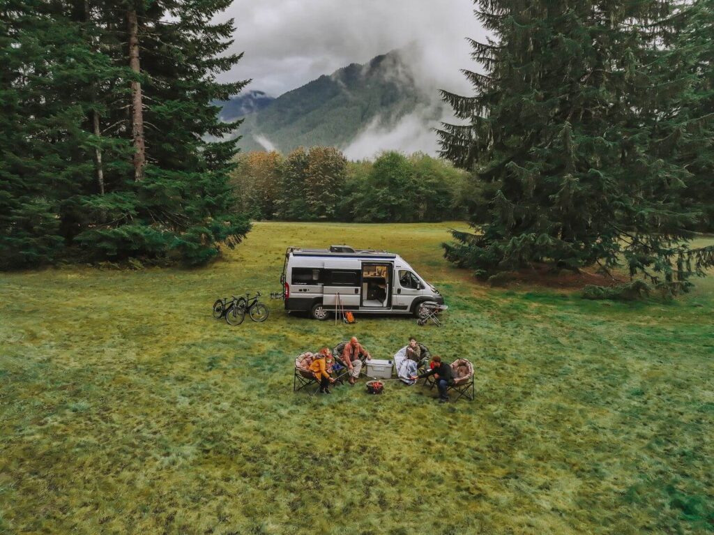 Class B Camper van set up for boondocking in open field