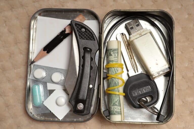 pencil cash USB stick key and meds inside Altoids tin