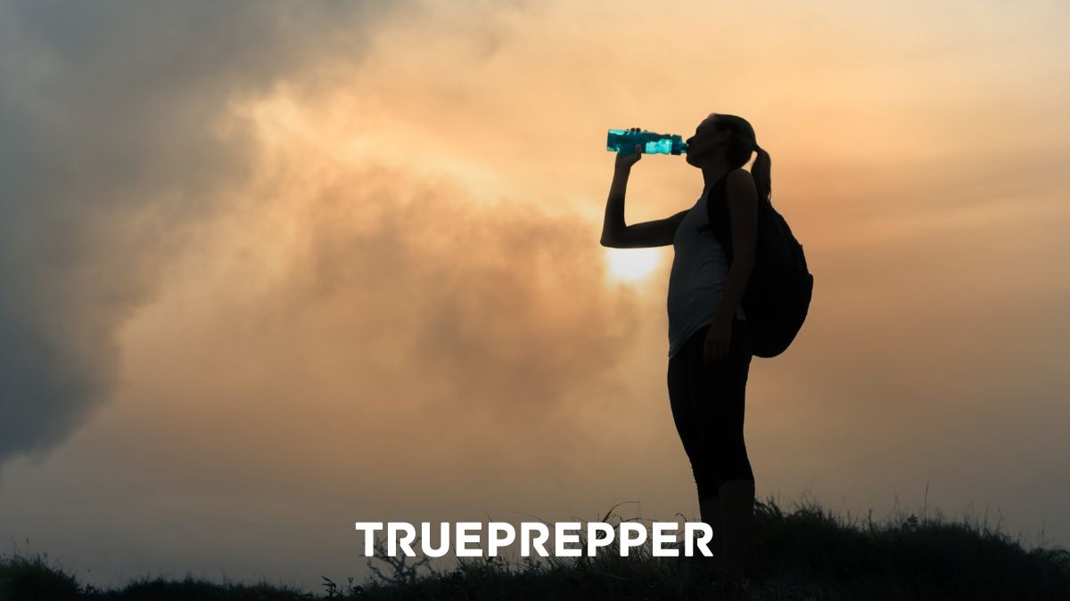 Bug Out Bag Water Storage Methods Woman drinking water from bottle