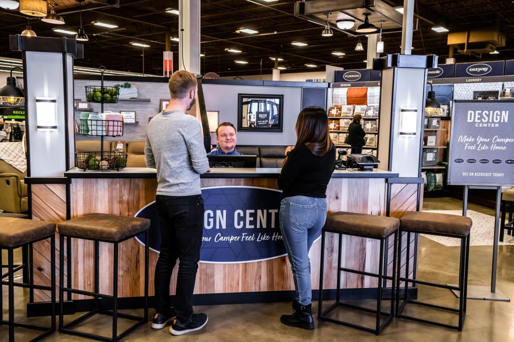 Couple talking with design specialist at Camping World Design Center