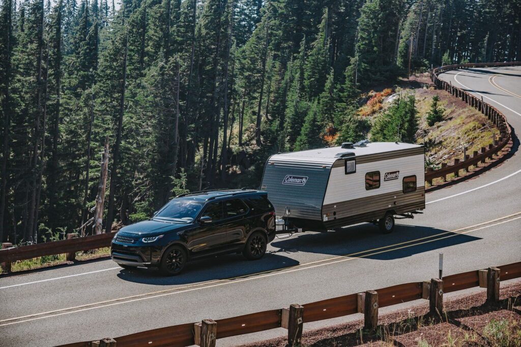 Coleman travel trailer towed by an SUV