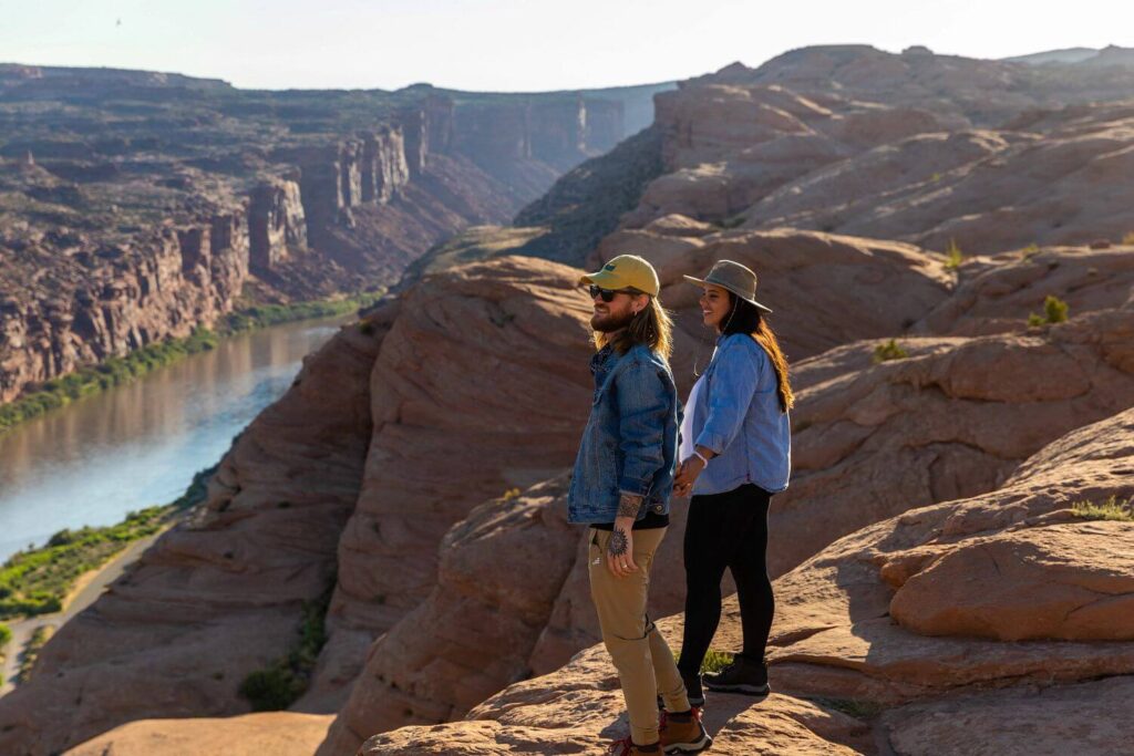 Couple hiking on the edge of a canyon