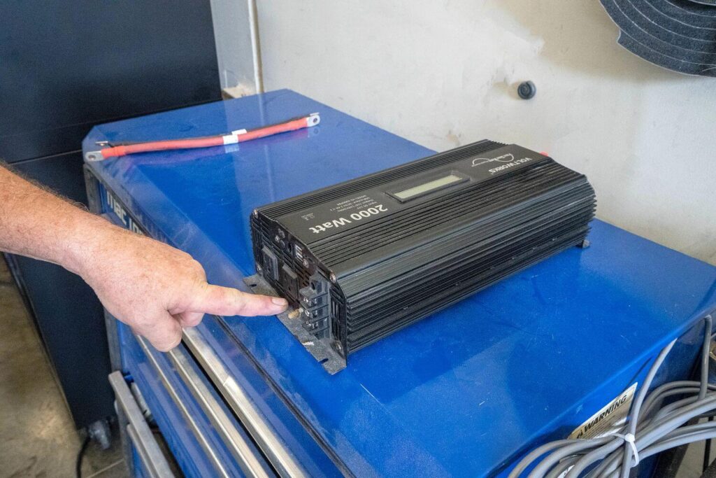 Technician testing RV inverter