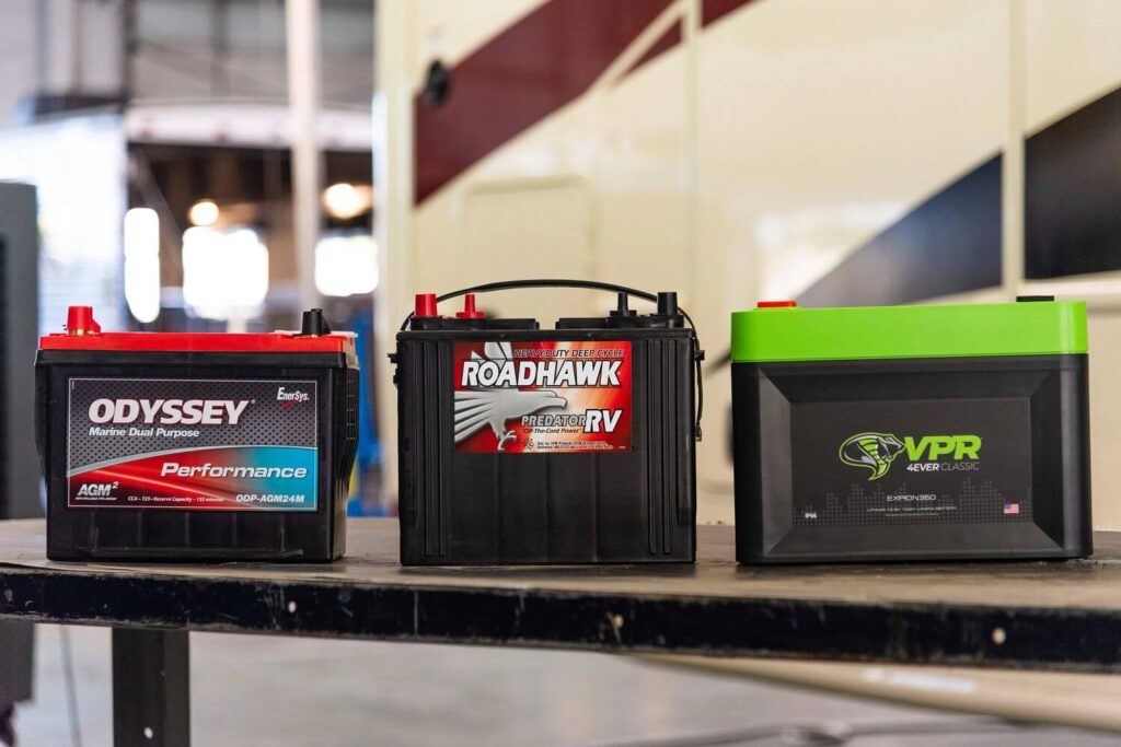 Three RV Batteries sitting on a table