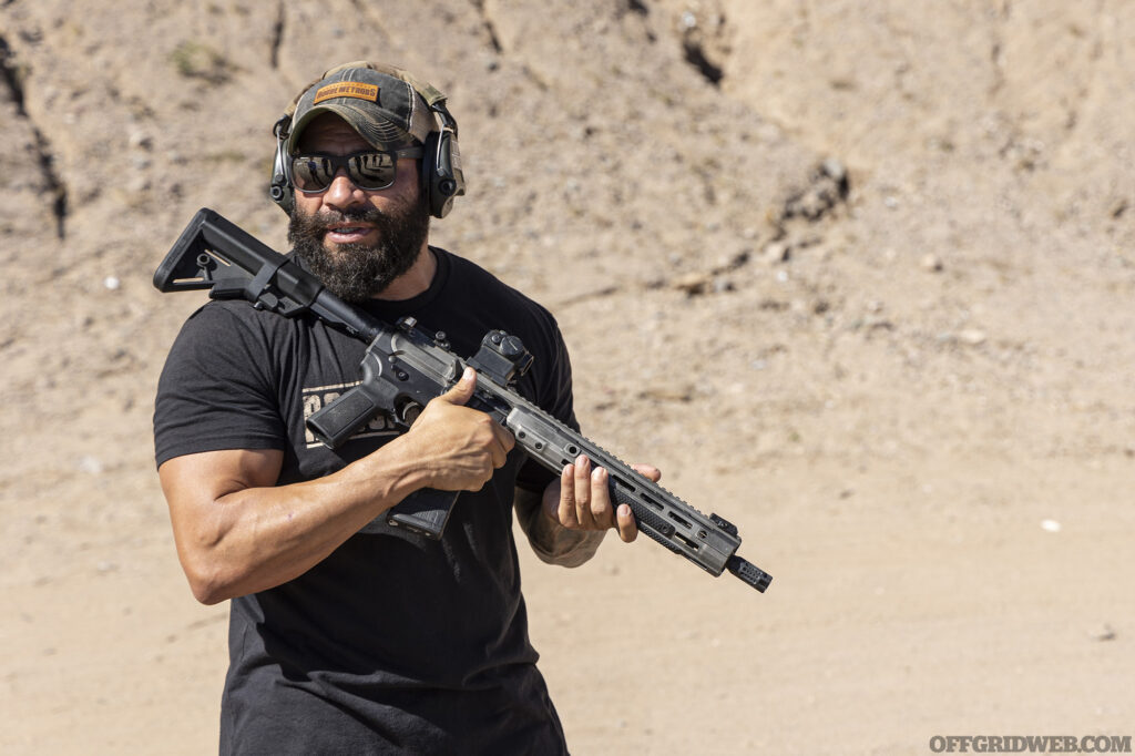 Photo of instructor Raul Martinez Jr. demonstrating with an AR 15.