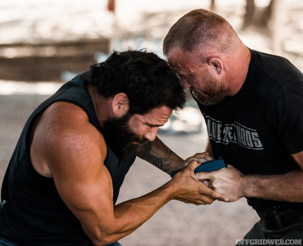 Raul Martinez demonstrating gun retention techniques.