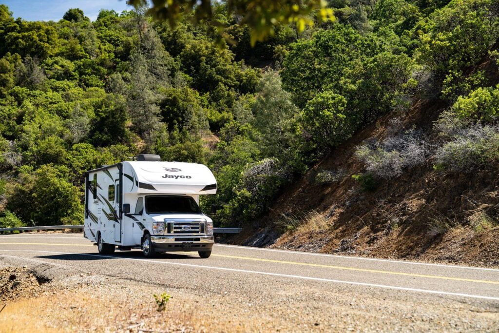 Class C RV driving on road