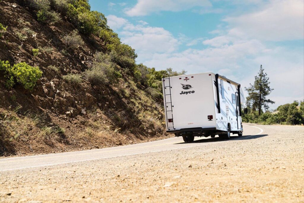 Jayco Class C RV driving away on the road